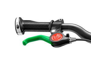 Woom 1 child-specific eye-catching green brake lever.