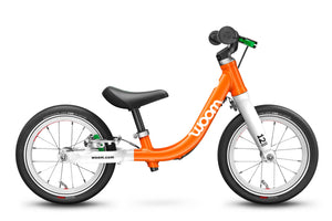 Woom 1 flame orange 12 inch wheel ultralight children's balance bike.